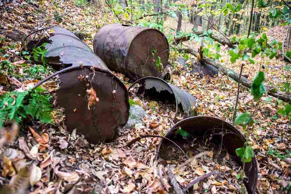 Metal drums and tannery waste at a former Wolverine World Wide dump site in Belmont, MI, where drinking water has been polluted with PFAS compounds. (Source: https://www.mlive.com/news/grand-rapids/index.ssf/2017/11/varnum_wolverine_lawsuit.html)